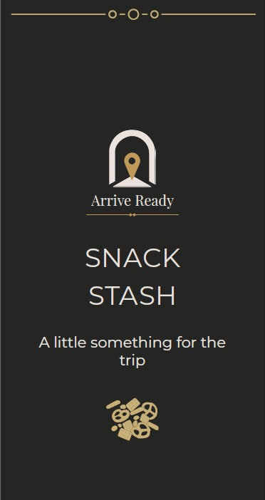 A dark brown rectangular package or box front with centered branding and text reading 'Arrive Ready' and 'SNACK STASH,' plus the tagline 'A little something for the trip.' The design uses white and metallic gold typography and iconography, with a small gold snack-themed graphic near the bottom.
